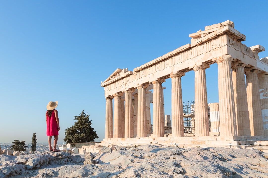 Woman in front of Parthenon temple on the Acropolis, Athens, Greece